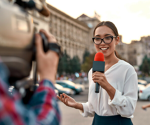 Coverage you can count on. TV reporter presenting the news outdoors. Journalism industry, live streaming concept.