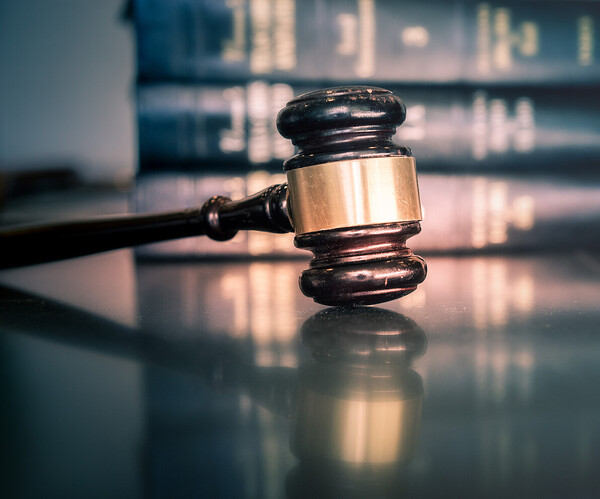 Legal law concept image Richterhammer und Gesetzesbücher