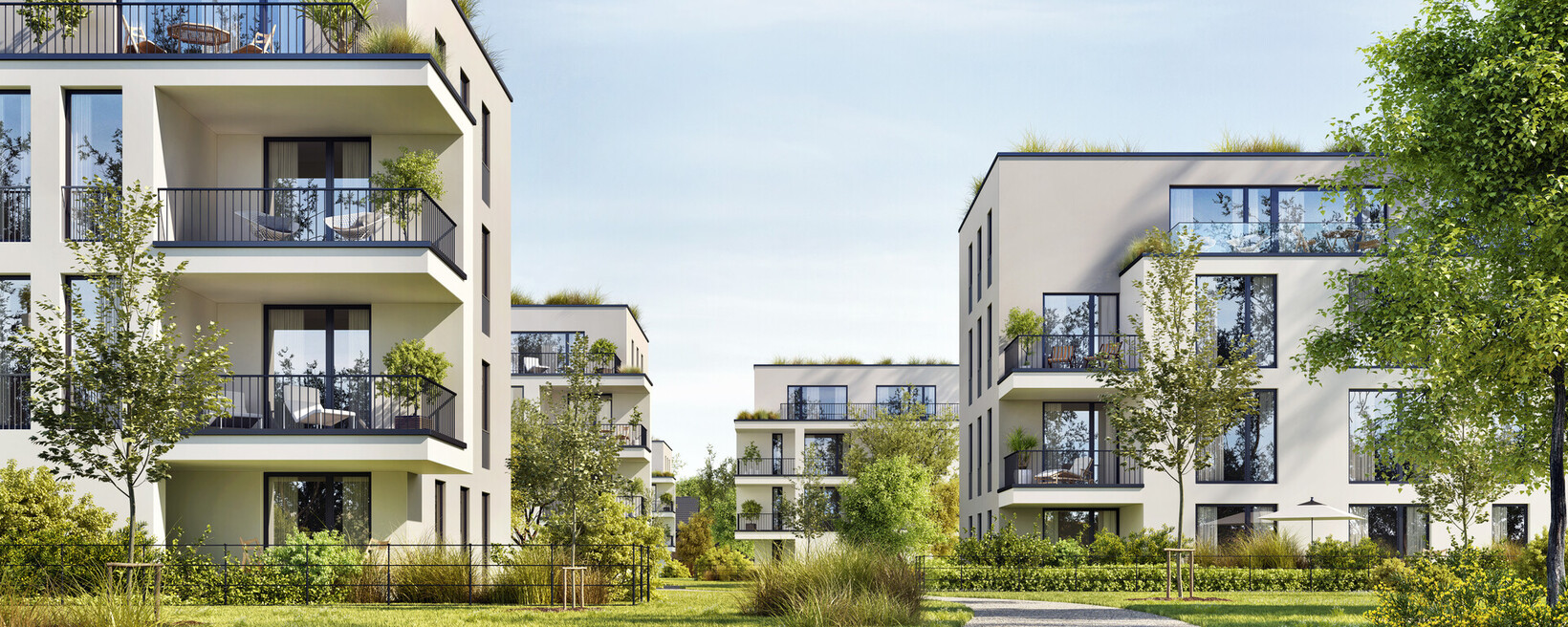 Mehrere moderne Häuser auf einer Grünfläche